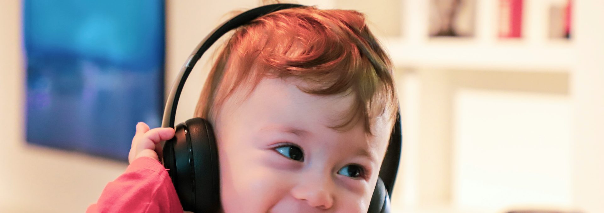 baby listening in black headset