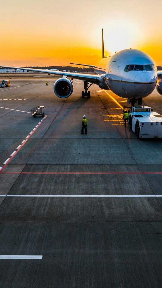 gray airplane on parking
