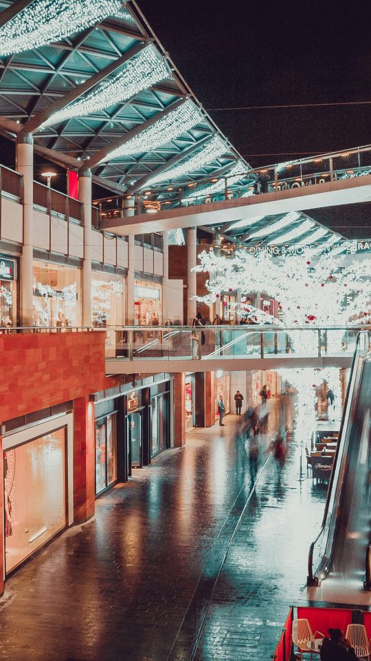 people inside building with escalator